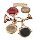 A group of six late 18th / early 19th century gold fob seals, including: one of swivel design, one