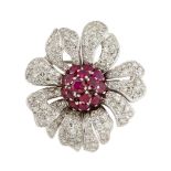 A ruby and diamond flower brooch, the flowerhead with pave circular-cut ruby domed centre to pave