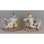 A pair of Continental tin glazed earthenware figures of a exotic man and woman, probably Italian,