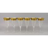 A collection of six large Moser cut and gilded glass goblets, 20th century, the rims with foliate