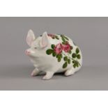 A small Wemyss pig, decorated with chrysanthemums and foliage, marked Wemyss, with printed mark to