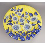 A large Italian tin glazed earthenware circular charger, of recent design by Ceramiche Giacomini,