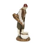 A Royal Worcester porcelain figure of a Turkish water carrier after a model by James Hadley,