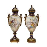A pair of Continental Sevres style porcelain and gilt metal mounted urns, late 19th century,
