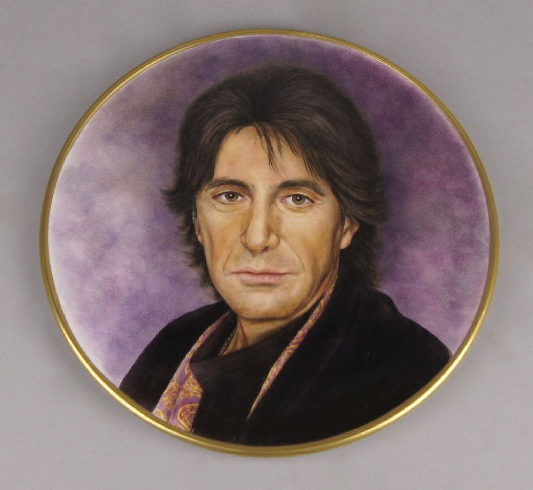 20th century School, a circular porcelain plaque of a portrait of a man, attributed to be Al Pacino,