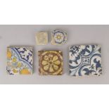 A square earthenware pottery tile, 18th century or earlier, decorated with a stylised floral