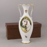 A Herend porcelain twin handled vase, 20th century, decorated with a portrai of an Arab stallion,