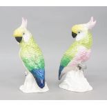 A pair of Crown Staffordshire bone china models of cockatoos, after a design by J T Jones, printed
