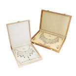 A boxed Indian filigree and garnet set parure, comprising festoon necklace, bracelet, ear pendants