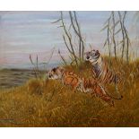 Manner of Friedrich Wilhelm Carl Kuhnert, German 1865-1926- Two tigers in grassland; oil on