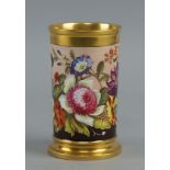 A Rockingham cylindrical spill vase, 19th century, decorated with a band of flowers and foliage