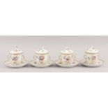 A set of four German porcelain trembleuse twin handled cups, with saucers and covers, late 19th/