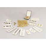 A large quantity of gentlemen's gold shirt studs, approximate total weight 59g, two French gold