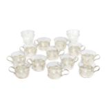 A set of twelve Continental 835 fineness silver tea glass holders, with clear class liners by Schott