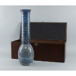 A Middle Eastern blue and white glass vase, of recent manufacture, of tall design inset with
