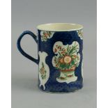 A Worcester cylindrical tankard, c. 1760, decorated with vignettes of flowers and sprays of