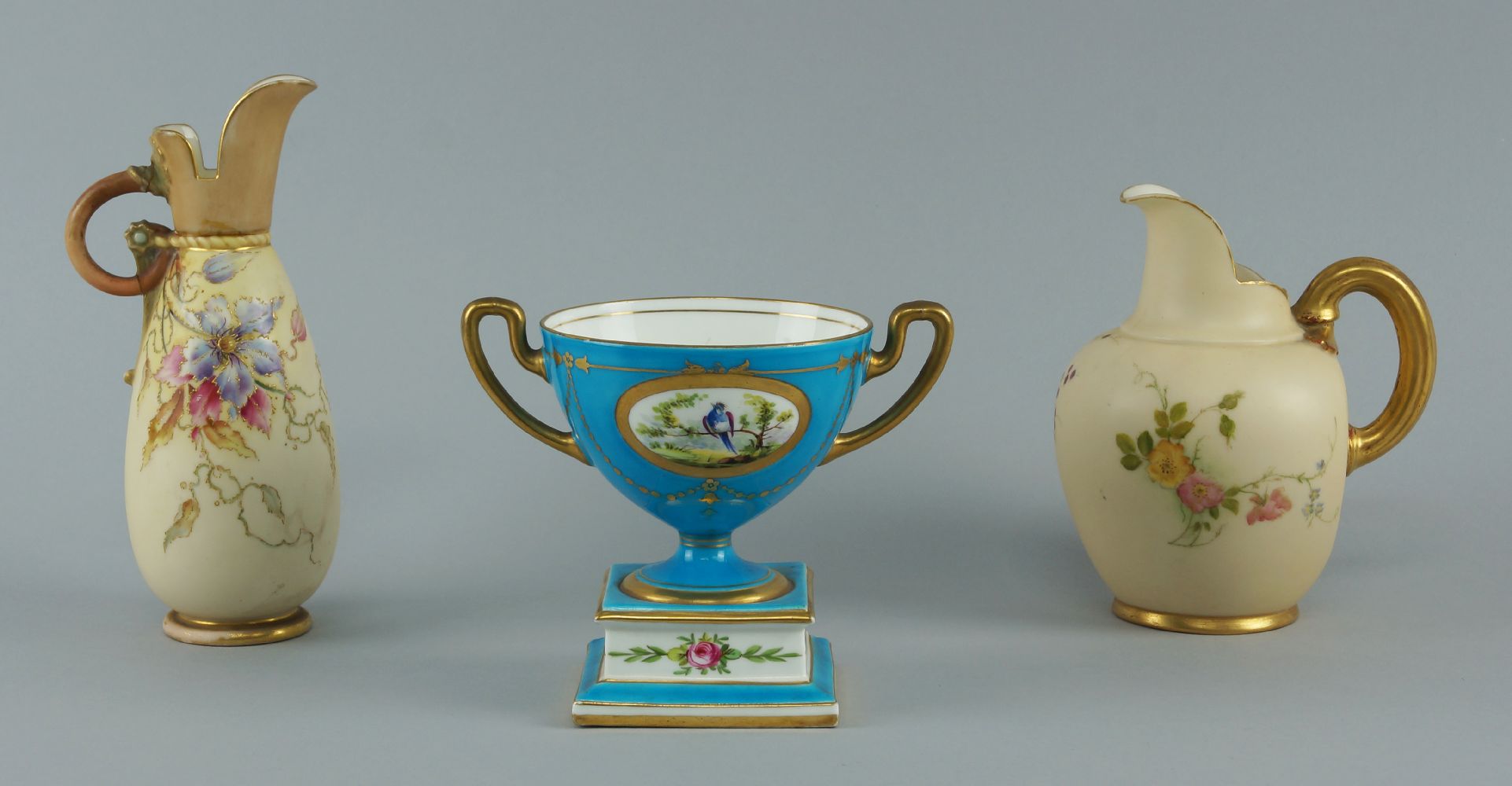 Two Royal Worcester blush ivory jugs, early 20th century, one with a lower squat form globular body,