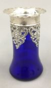 A silver mounted blue glass vase
