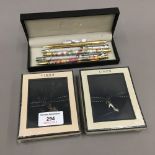 Two boxed Links of London pendants and a quantity of pens