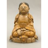 A Chinese brown glazed figure of Buddha