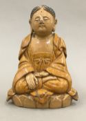 A Chinese brown glazed figure of Buddha