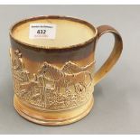 A 19th century salt glazed frog mug