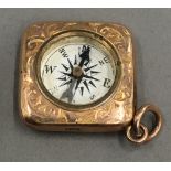 A 9 ct gold novelty compass charm (4 grammes total weight)