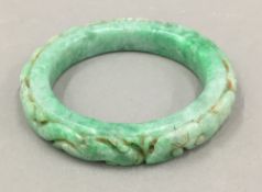 A Chinese carved jade bangle