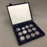 A box of silver proof coins and other silver coins