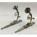 A pair of bronze wall lights