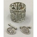 A pair of Chinese silver cufflinks together with a Chinese white metal napkin ring (22.