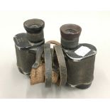 A pair of German WWII Dienstglas binoculars by Emil Busch 6x30 CXN with shoulder and button straps,