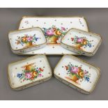 A Continental porcelain florally decorated tray and four small matching dishes