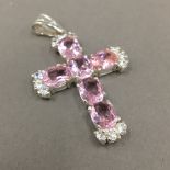 A silver pink and cubic zirconia pendant/cross