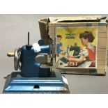 A boxed child's sewing machine