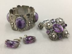 A Mexican silver mineral set bangle and earrings,