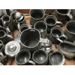 A collection of antique pewter tankards, etc.