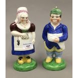 A pair of 19th century Staffordshire Prattware type figures