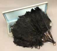 A vintage black ostrich feather fan,