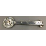 An unmarked Continental silver chamber stick with elongated handle,