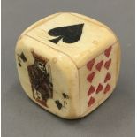 A bone box formed as a dice containing small dice