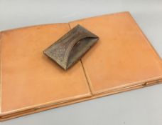 A leather desk pad and blotter