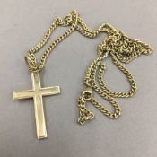A 9 ct gold crucifix on 9 ct gold chain (13 grammes total weight)