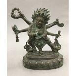 A patinated bronze of a multi-armed deity