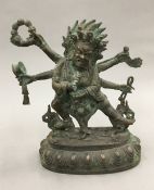 A patinated bronze of a multi-armed deity