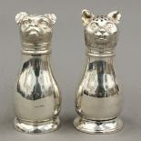 A pair of silver plated cat and dog salts