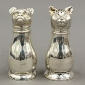 A pair of silver plated cat and dog salts