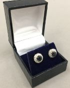 A pair 18 ct gold sapphire and diamond earrings