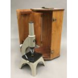 A vintage cased microscope