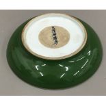 A Chinese porcelain green shallow dish